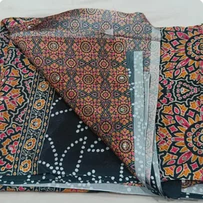 Black bandhani print saree with mirror work and Ajrakh print